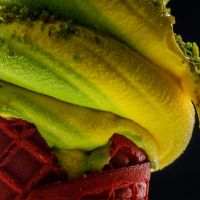 closeup photo of mango soft serve ice cream cone