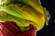 closeup photo of mango soft serve ice cream cone